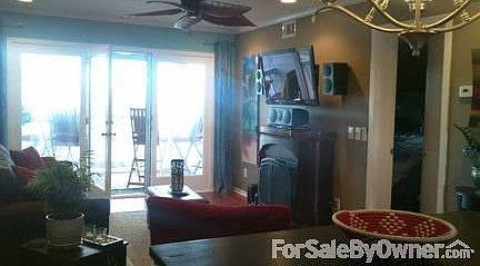 Living Room with View of the Ocean
						:
						ALL FURNITURE INCLUDED. Crown molding, ceiling fan, surround sound.