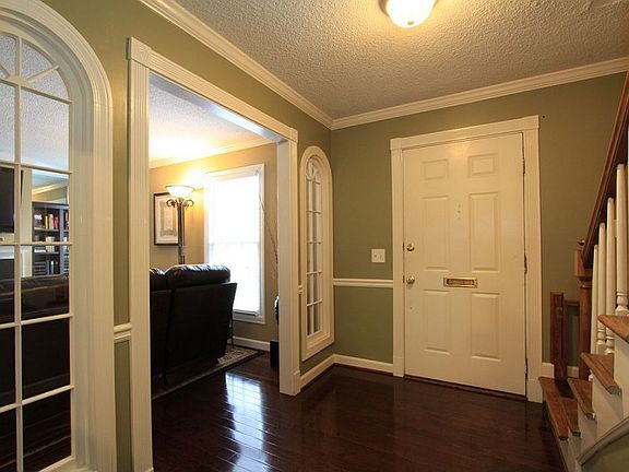 Large foyer has coat closet.