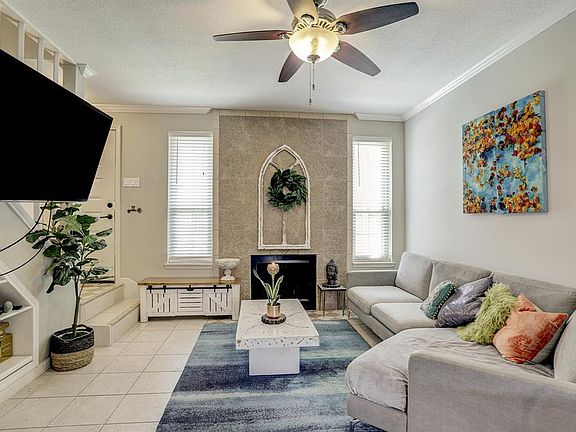 Spacious living area freshly painted in all neutral colors.