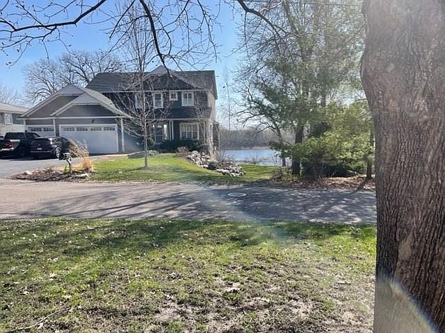 Front of house has partial lake view from living room