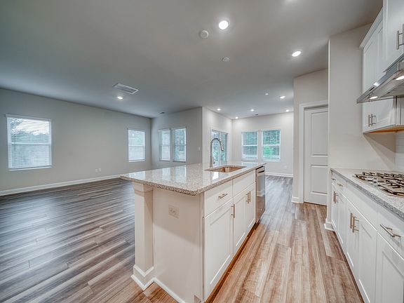 Plenty of windows offer bright, natural light to the living space.