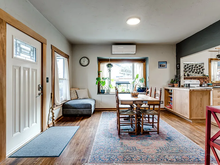 Dining room flows to both living room and kitchen.