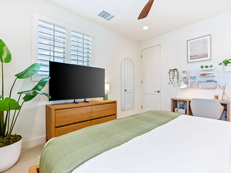 Bedroom 3 has a convenient desk for remote workers and a walk in closet for all your items.