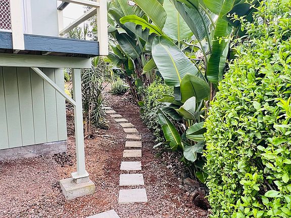 view of pathway to side of the house