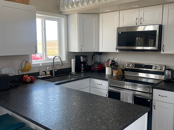 Beautiful full kitchen with east view.