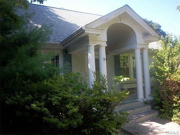 Front entrance with covered blue stone porch...