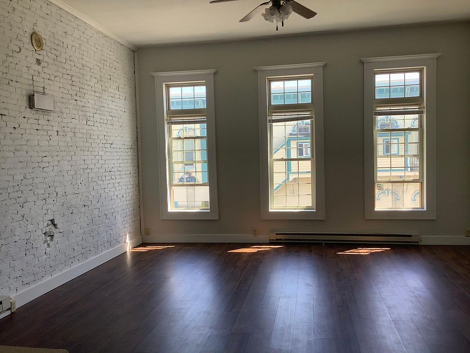 1870's brick wall from when retailers lived above their stores. Note the fireplace vent area!