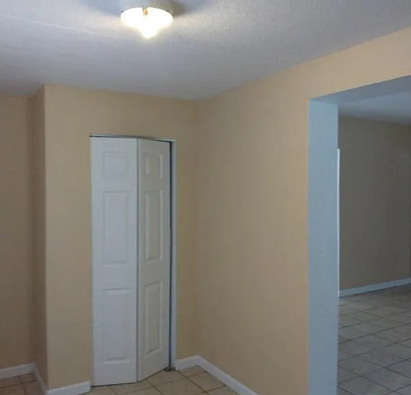 View from front entry door where you step into the foyer/mudroom area.