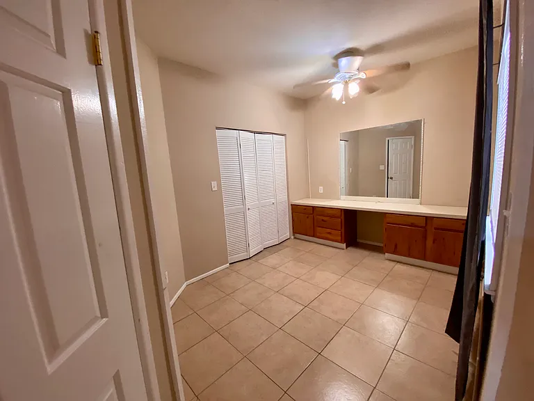 Bedroom with built in dresser plus a closet
