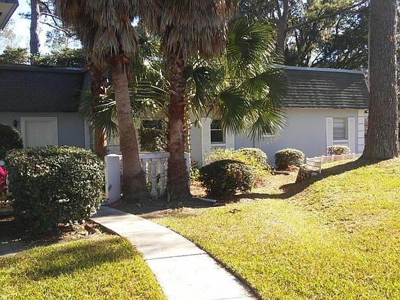 Front door to the left with patio entrance. This area is currently being relandscaped