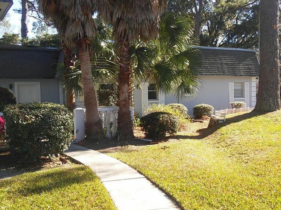 Front door to the left with patio entrance. This area is currently being relandscaped