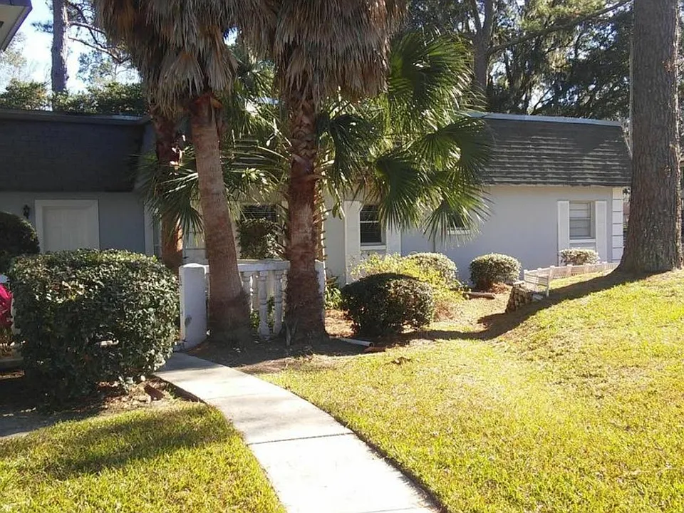 Front door to the left with patio entrance. This area is currently being relandscaped
