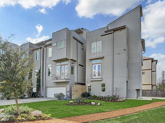 The side view of the home shows the views from the second floor dining area with balcony and 3rd floor bedroom above.