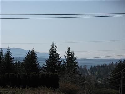 There's a good chance that the three or so trees on the right can be topped to open up the view. Ask