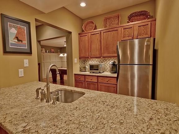 Kitchen recently remodeled to include stove and fan.
