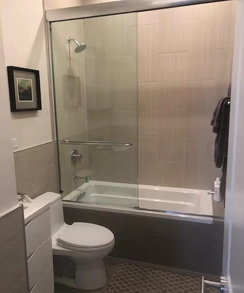 Madly bath cabinets with storage. Toto toilet. Bathtub with shower.