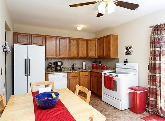 Eat in kitchen, newer oak cabinets, vinyl flooring(looks like stone) and granite counters.