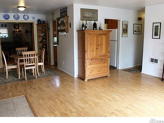 Another view of the living room. Notice the newer laminate flooring throughout.