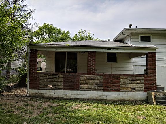 nice back covered porch w/ large fenced in back yard