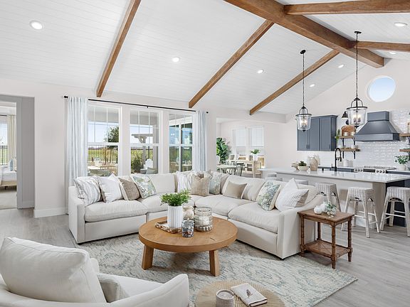 Great room with vaulted ceiling and stained ceiling beams