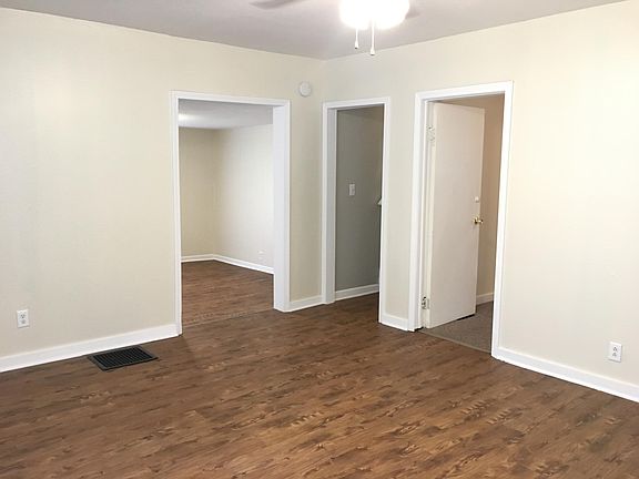 Living Room view - dining room, stairwell, bedroom (left to 