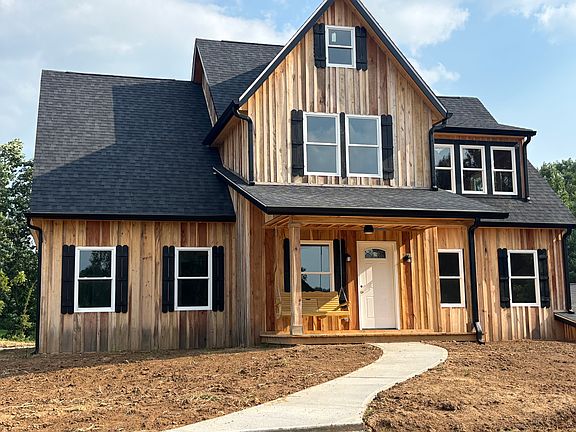 Entire residence is sided with natural cut timber milled on site. will be custom painted when it dries in the spring of 2026. Construction is now complete.