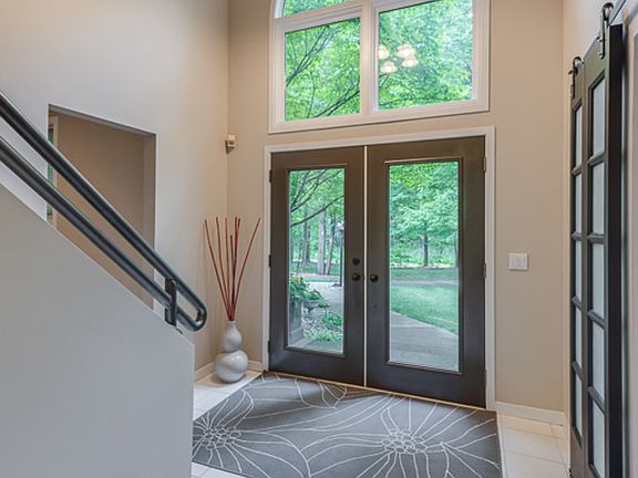 This home has a two story Foyer with a large window that allows for the light coming into the home.