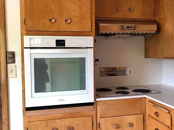 Mixture of vintage and new appliances, including new Bosch dishwasher. (New flooring not reflected in this photo)