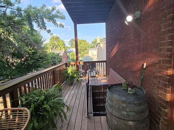 2nd floor deck off kitchen with stairs to off street parking