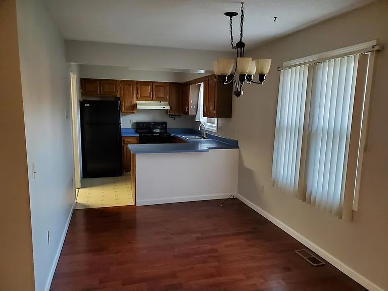 Dining / Kitchen.
Kitchen cabinets have been painted white and granite countertops installed.