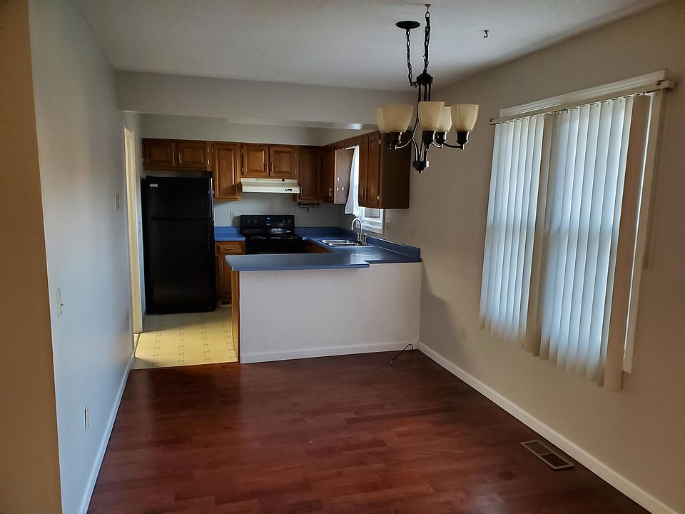 Dining / Kitchen.
Kitchen cabinets have been painted white and granite countertops installed.