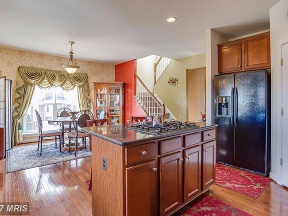 Opens to breakfast area, dining, and family room!