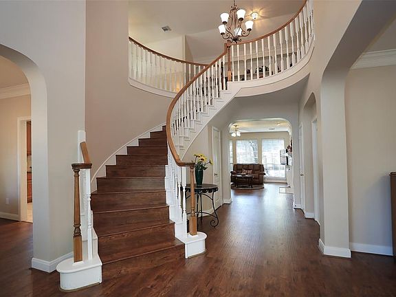 Dramatic 2-Story Foyer with Sweeping Staircase will impress your most discriminating guests.