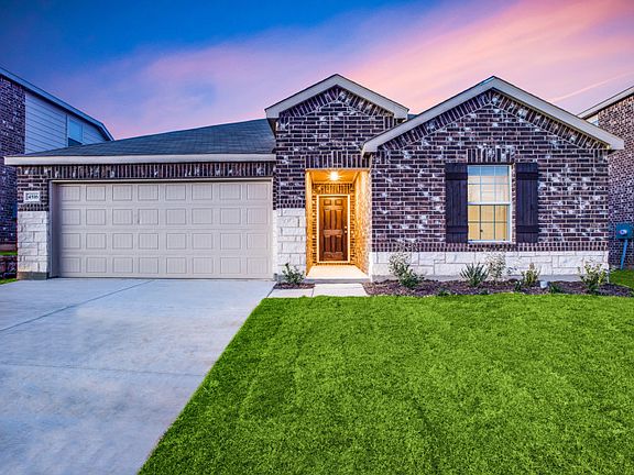 The Rayburn, a one-story home with 2-car garage, shown with Home Exterior Q