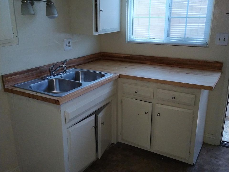 Kitchen with new sink and new butcher block countertop