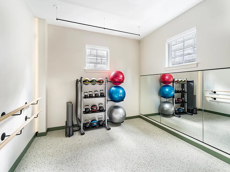 This light-filled studio is perfect for stretching, yoga, or low-impact movement_complete with medicine balls, kettlebells, and mounted ballet barres.