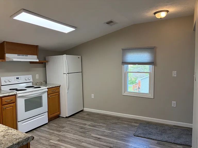 Kitchen with self-cleaning oven, dishwasher and icemaker in freezer