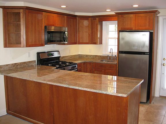 New Kitchen with Granite Countertops and Stainless Steel Appliances