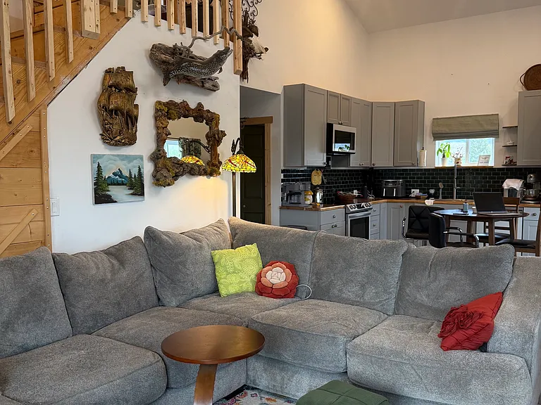 Ground level of view of living space into the kitchen area