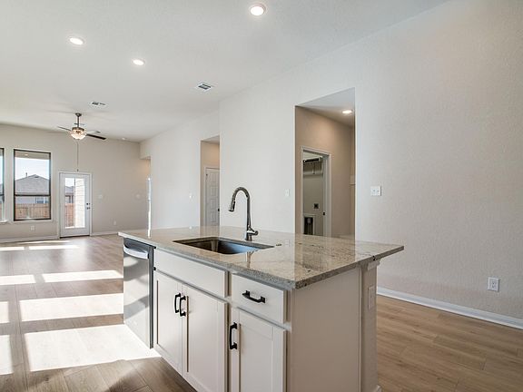Great room: Kitchen, dining open to living room.