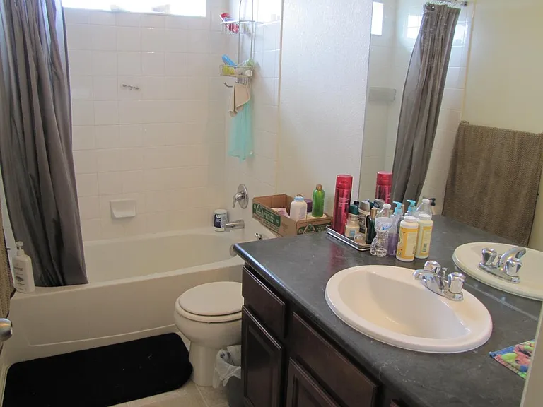 Full bath in little hallway for the other two bedrooms