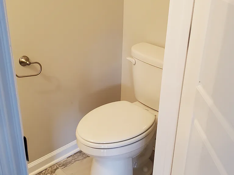 Downstairs half bath off entryway