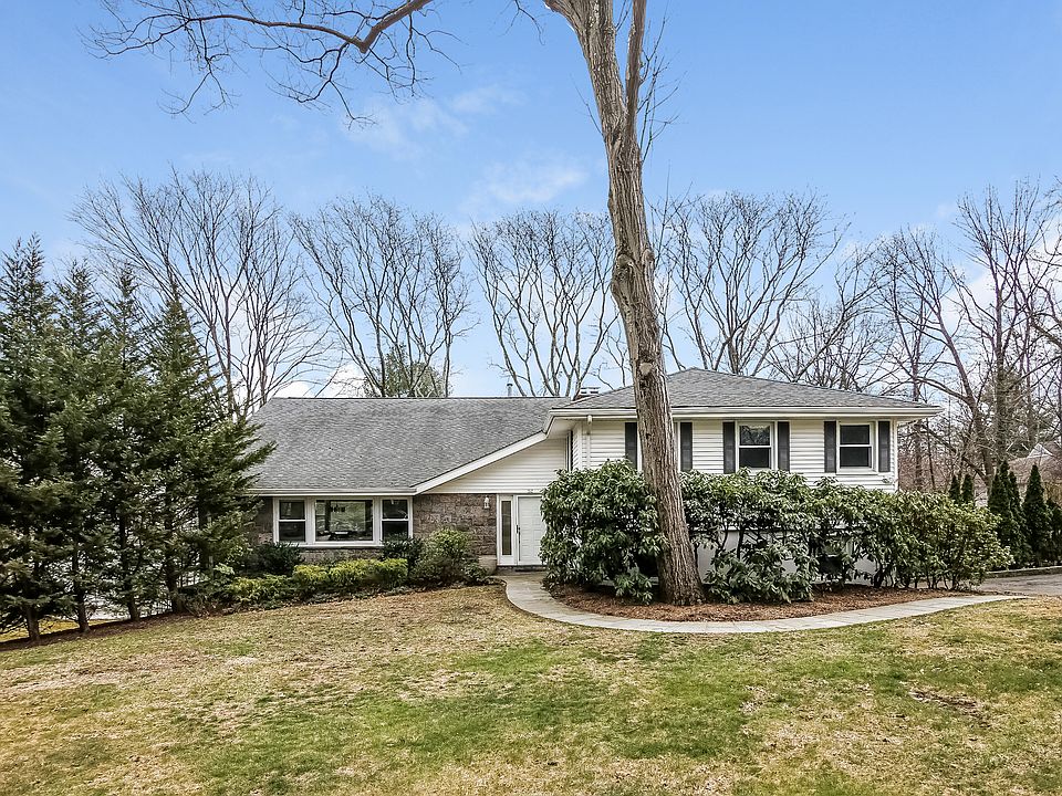 Large open front yard with convenient walkway from driveway.