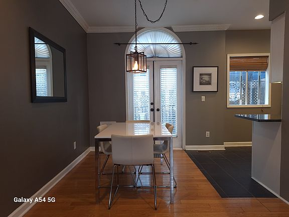 Dining area with table/chairs and French doors onto deck.