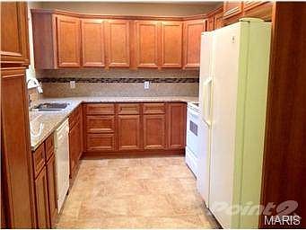 Updated kitchen with new custom cabinetry, granite counter tops