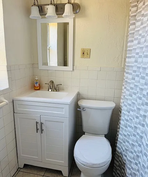New Toilet and Vanity. New finished shower tub