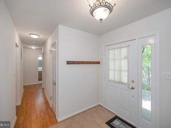 Front Entry Foyer & view to bedroom hallway