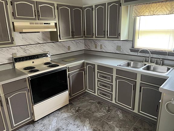Kitchen with accented cabinet.
