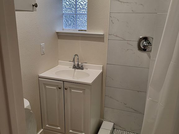 Entirely new baths & plumbing throughout property. Hall bathroom