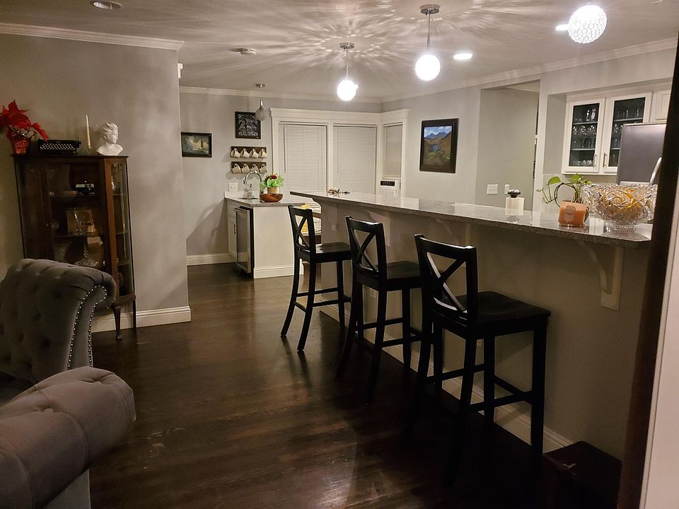 Open concept kitchen, dining, and living space.